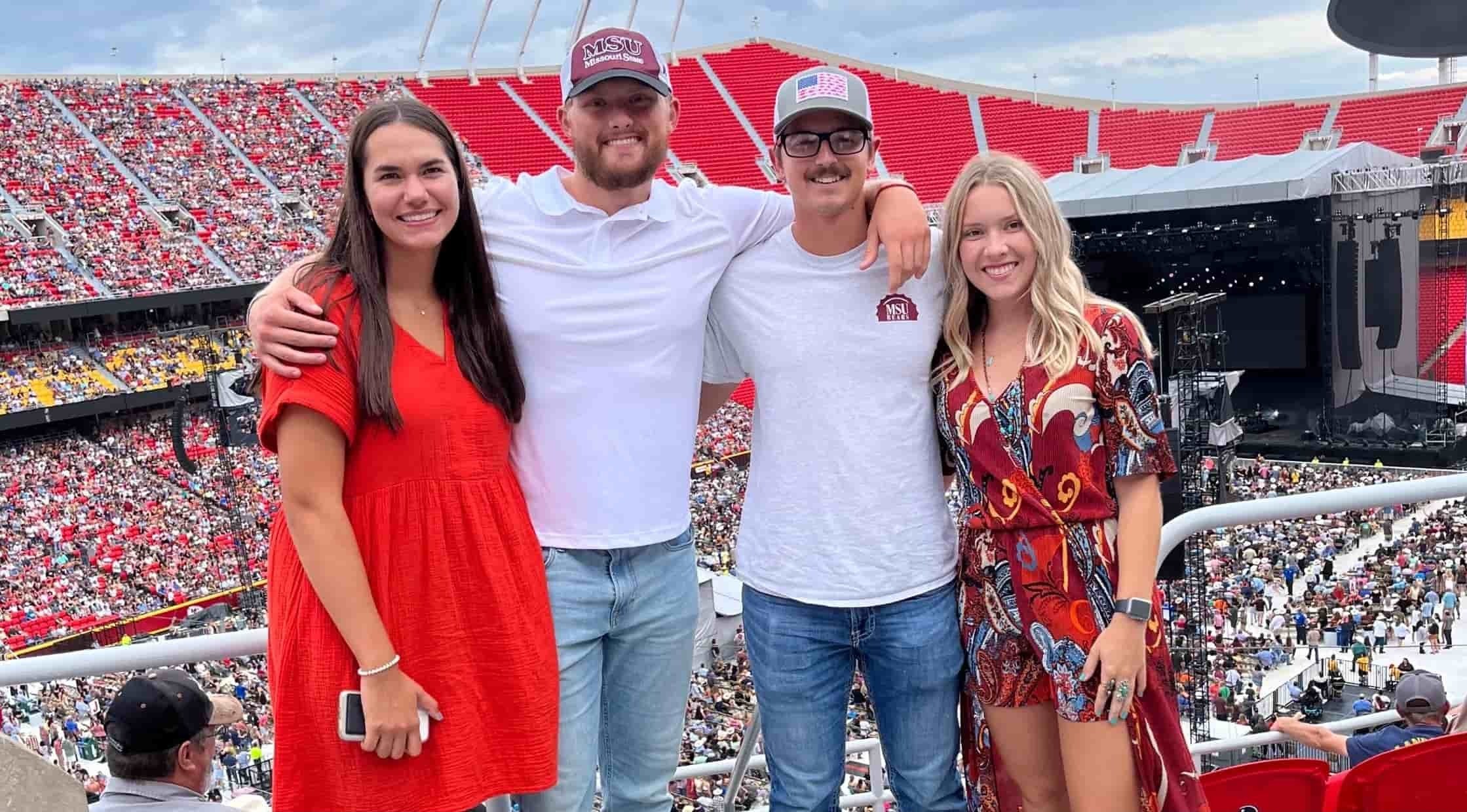 Brennan, Tyler and their wives at a ballgame
