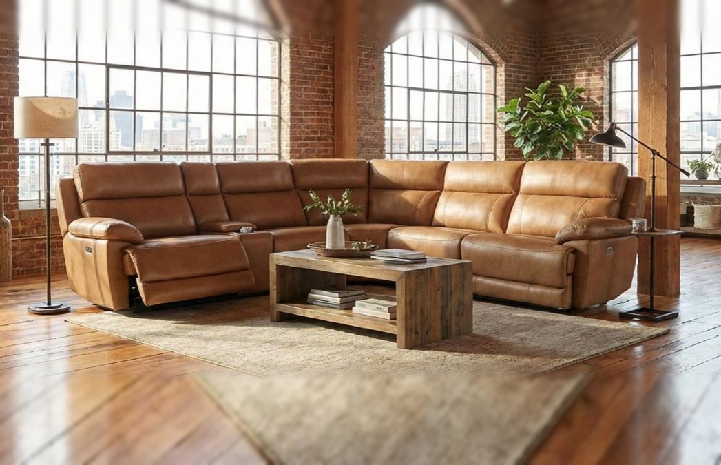 Cognac leather reclining sectional in a brick loft