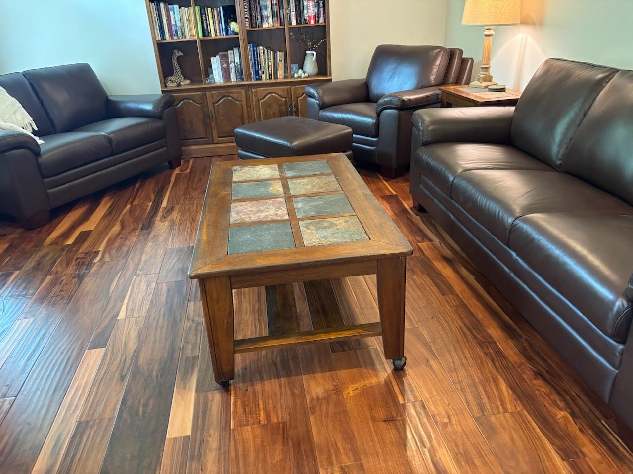 Customer living room with leather sofa, loveseat and chair