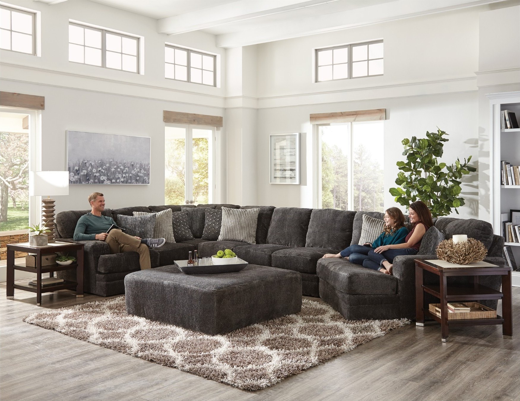 Jackson Mammoth sectional in Smoke with a family relaxing